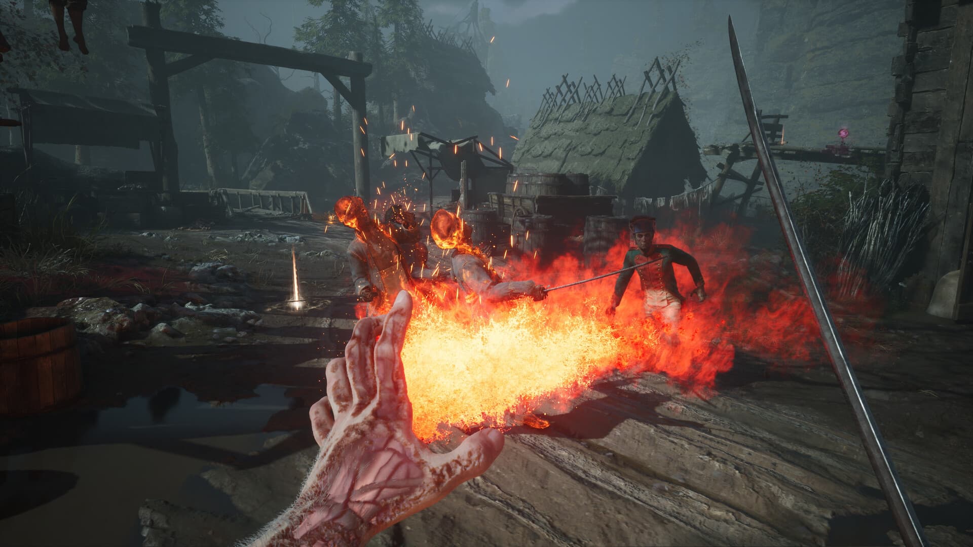Captura de Valor Mortis: la mano del protagonista lanza una llamarada contra un enemigo en una aldea en ruinas