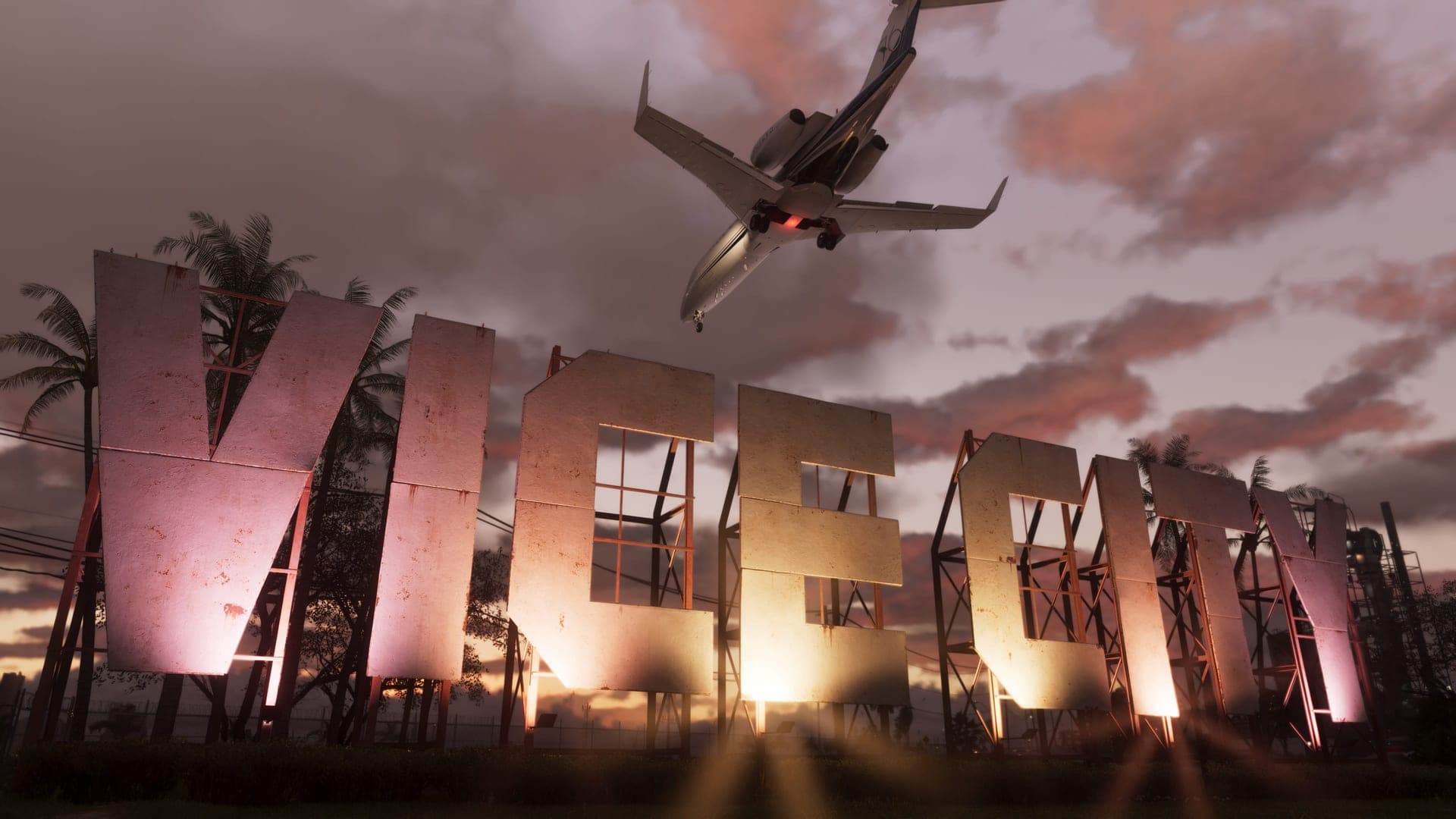 El cartel de Vice City entre palmeras al atardecer, en una captura oficial de Grand Theft Auto VI